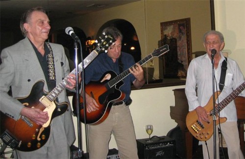  Randy with Lou Pallo, guitarist with Les Paul. Notice the glass of wine on the amp. 